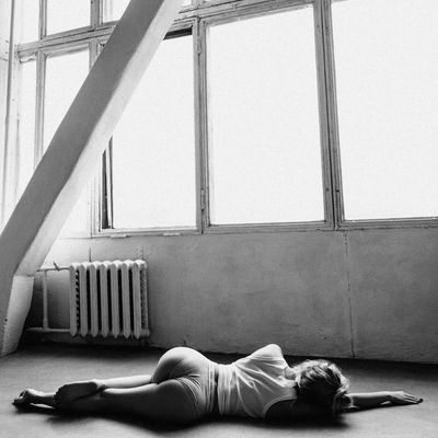 A calm and minimalist yoga studio interior.