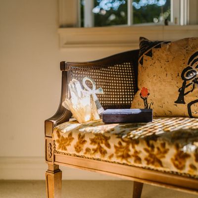 Yoga mat rolled up next to a window with soft light.